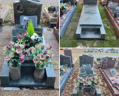 Tombe de cimetière ornée de fleurs artificielles colorées dans des vases, entourée de pierres grises et de feuilles mortes sur le chemin.